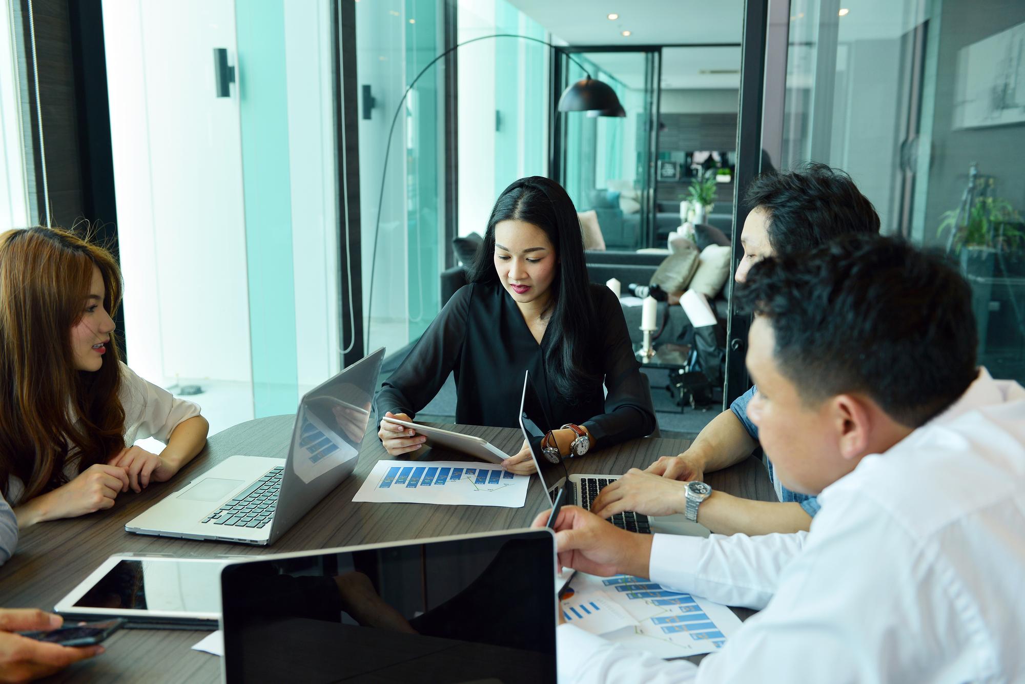 Professional business consultation services team meeting in modern Malaysia office environment